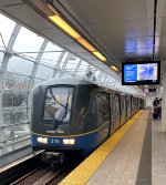 A set of Mark III Cars slows for Main Street-Science World Station